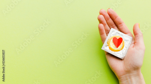 Contraceptive method composition on green background with copy space