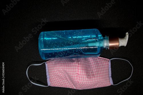 Картината върху платно Blue hand sanitizer and gag  mask used to prevent the virus from ovid -19