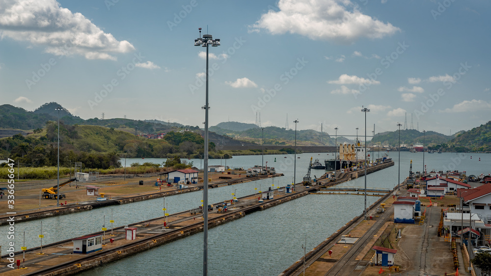 Huge ship is moving transportation over Panama Canal. Panama City and water transport. 