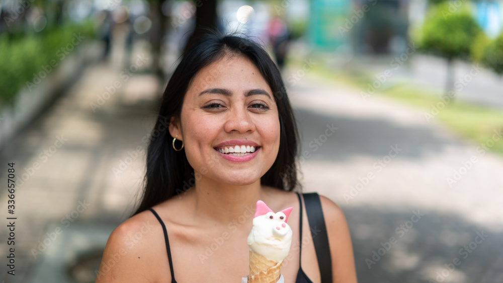 Girl eating funny ice cream is smilling. Summer vibes lifestyle.