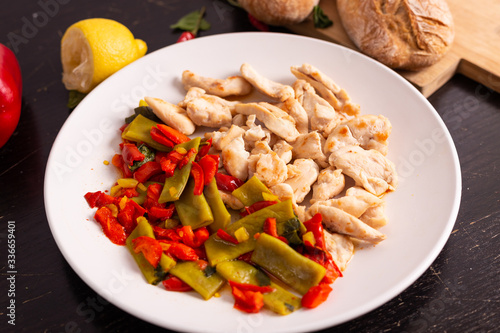 Chicken nuggets with lemon and mix vegetables. Low fat protein lunch, fast lunch.