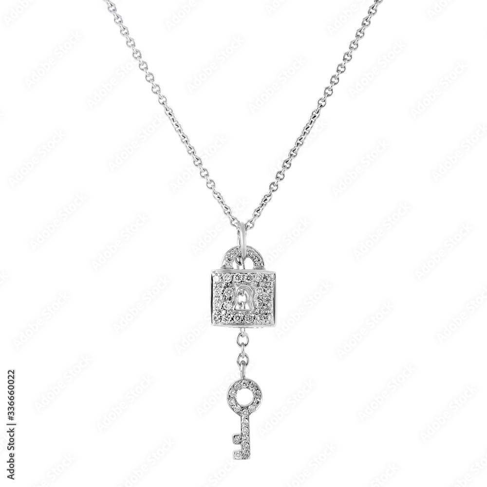 White gold pendant lock and key on a chain with diamonds isolated on white background White gold pendant lock and key on a chain with diamonds isolated on white background