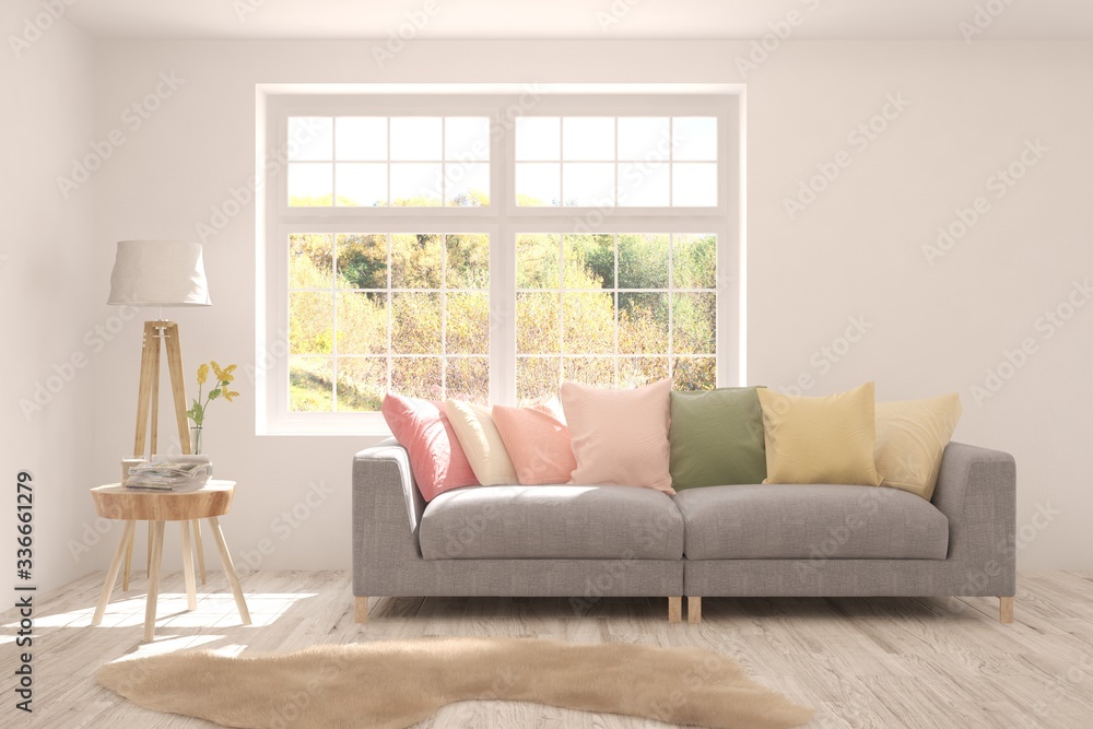 Fototapeta premium Stylish room in white color with sofa and autumn landscape in window. Scandinavian interior design. 3D illustration