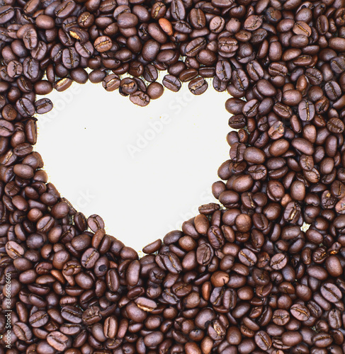 coffee beans with space in white heart shape background. Coffee with copy space background.