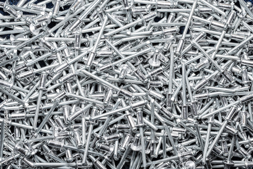 Many Pop Rivets background, popular fastener used in fabrication, steel and aluminium fixer, connector and joiner.