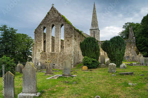 View of the ruins of the medieval church of St. Mary in the Irish city of New Ross, with the old cemetery in the foreground.