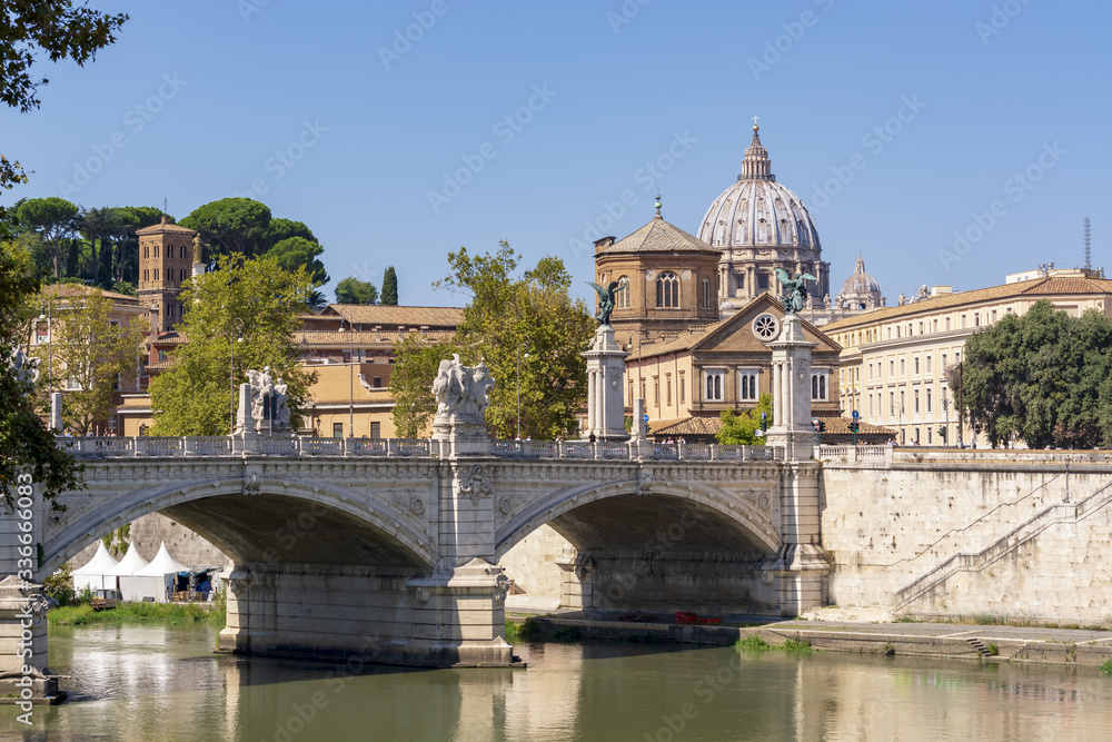 dome of San Pietro seen from the Tiber river