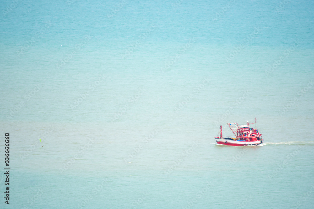 Fishing boats sailing in the sea without waves. Fishing boats sailing in the sea without waves.