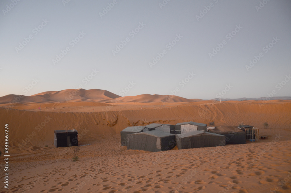 The traditional berbers tent in Merzouga. It is a small Moroccan town in the Sahara Desert, near the Algerian border. The traditional berbers tent in Merzouga. It is a small Moroccan town in the Sahara Desert, near the Algerian border.