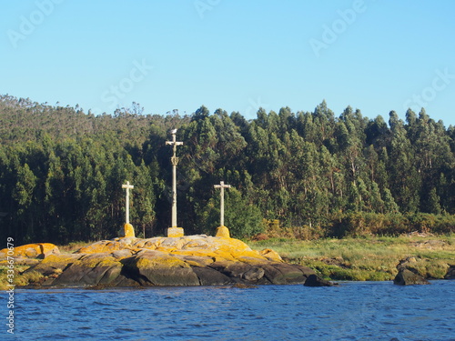Obraz na płótnie Three crosses floating on the sea, Camino de Santiago, Way of St