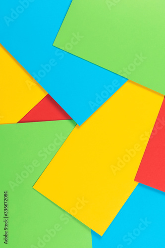 Free Download Colorful background. Red, blue, yellow and green paper cards. Top view. - GFXLoad