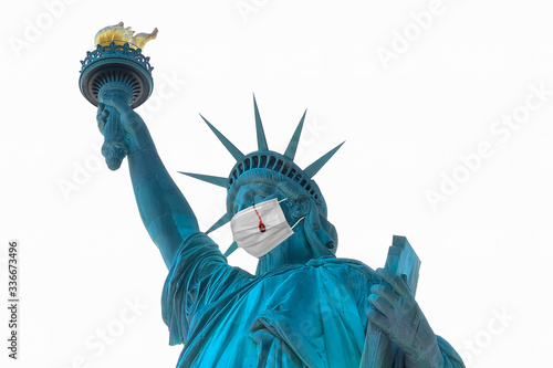 Representation of Statue of Liberty with a protective surgical mask and crying tears of blood as consequence of Covid-19 coronavirus deaths