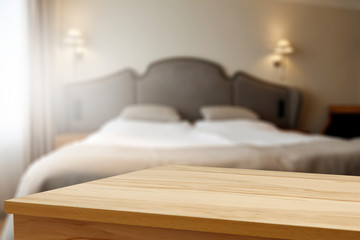 Table background of free space and blurred bed 
