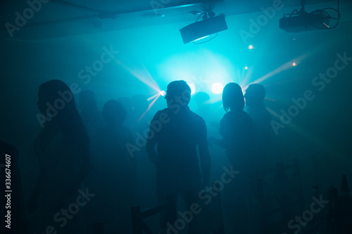 silhouettes of people at a party