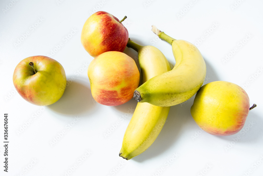 Composition with fruits: Banana and apple isolated on white background Composition with fruits: Banana and apple isolated on white background