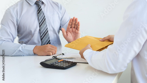 Slika na platnu Businessman refusing receive bribe money in the envelope of their partner to giv