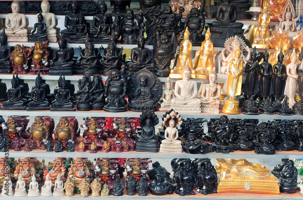 buddha statues on a street market in Asia