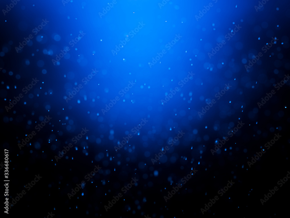 Blue bokeh on a dark background. Blur the background and wallpaper