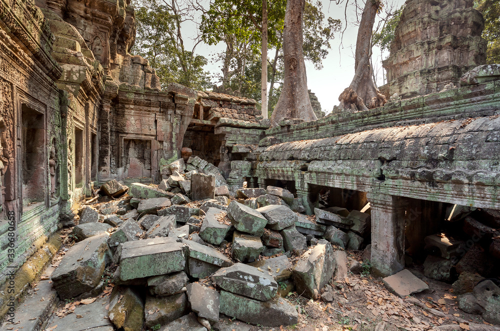 Broken walls of the famous temple Ta Prohm, 12th century structure, Cambodia. Historical place in Angkor. UNESCO world heritage site