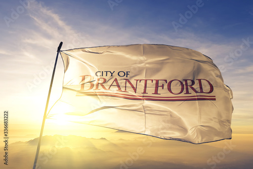 Brantford of Ontario of Canada flag waving on the top sunrise mist fog photo