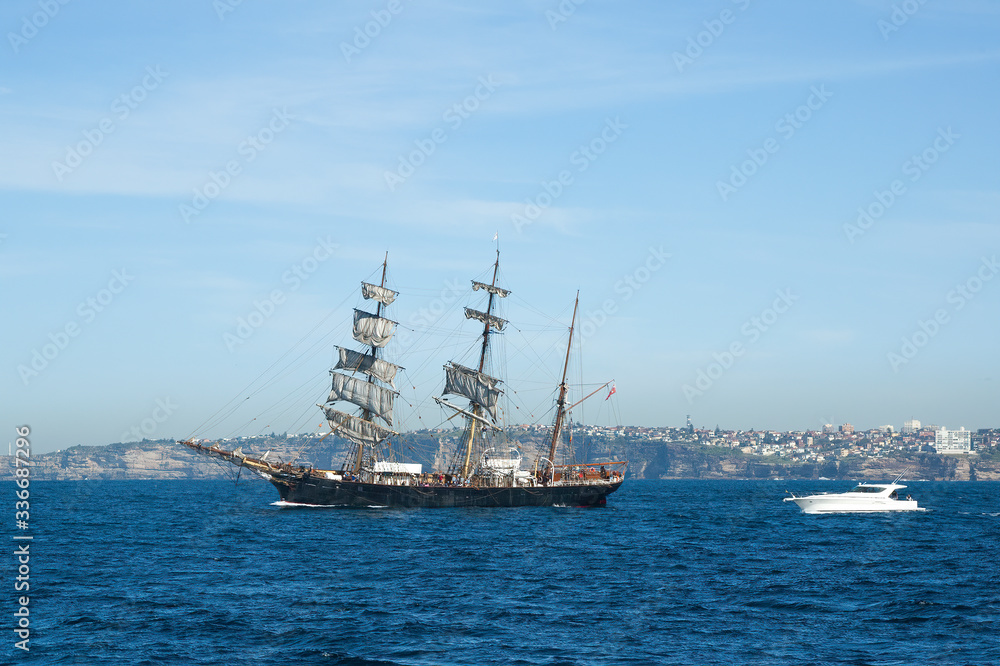 Sydney Australia, view of old schooner and speed boat off coast Sydney Australia, view of old schooner and speed boat off coast