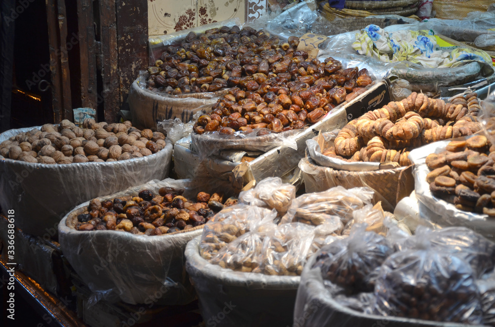 Fes market that selling local produce. Moroccan cooking is enhanced with fruits, dried and fresh — apricots, dates, figs, and raisins, to name a few.