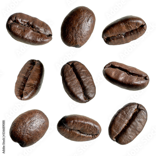 Close up falling coffee beans isolated on white background including clipping path. Collection of various coffee beans. 