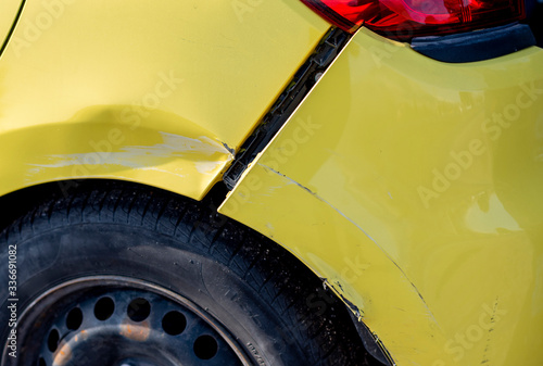 scratched car with damaged paint in crash accident or parking lot