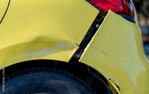 scratched car with damaged paint in crash accident or parking lot