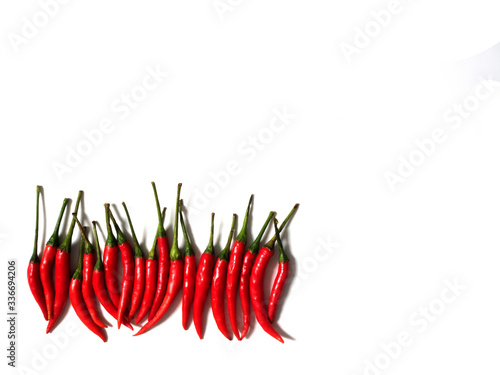 A lot of many red hot chili, space concept peppers, popular, spices, on top view, flat lay, isolated on white background