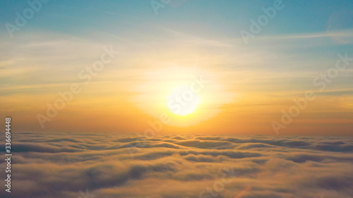 Yellow and blue dawn over clouds, concept, travel and leisure.