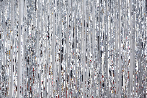 Christmas and New Year background, tinsel or shiny ribbons