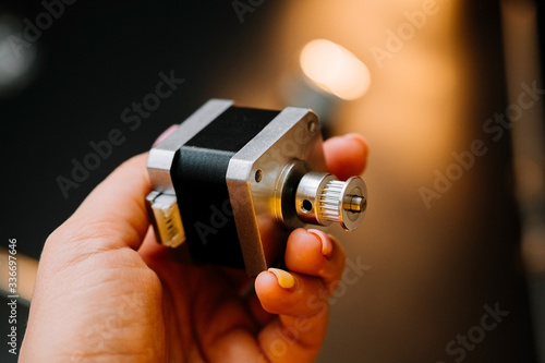 hand holds stepper trapezoidal motor nema 17. how to assemble a cnc machine do it yourself.