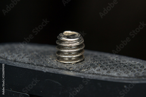 close-up photo of a screw used in phoography industry photo