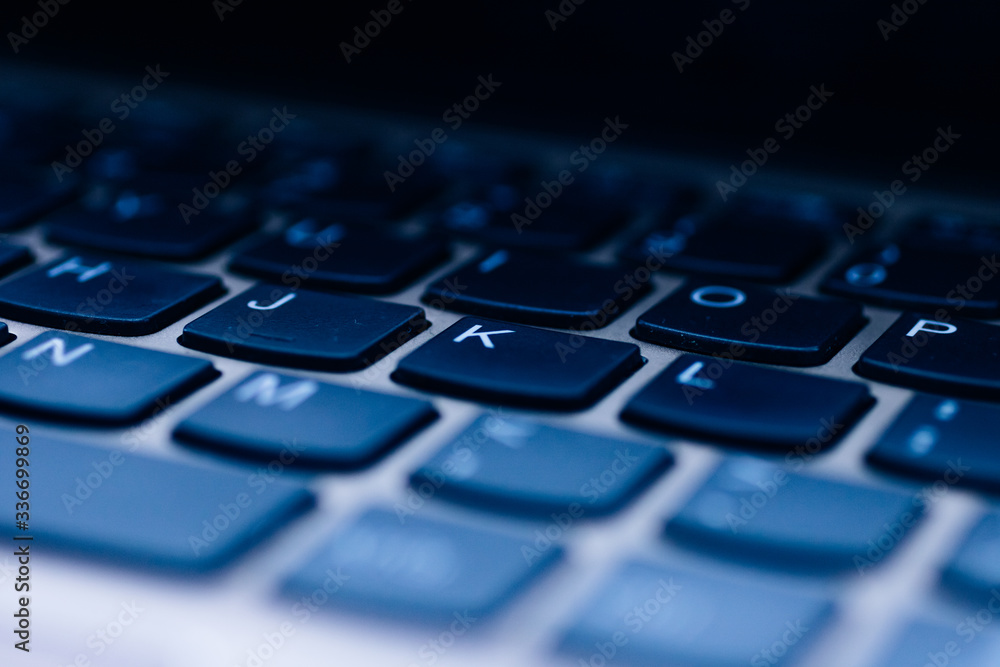Blue tinged laptop keyboard Blue tinged laptop keyboard