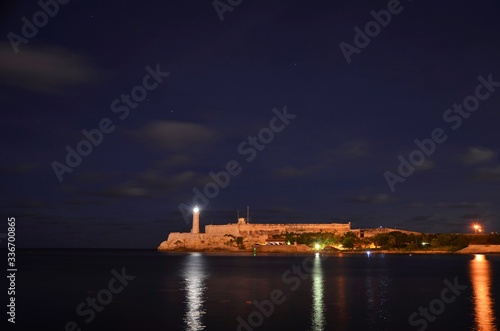 Havana bay fortress and lighthouse at night