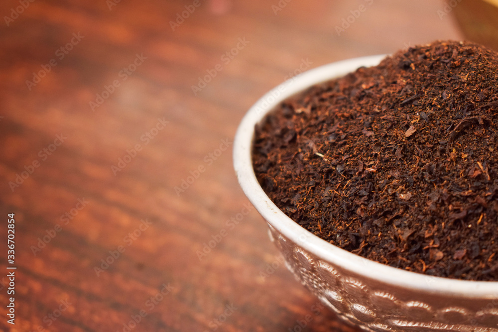 Dry Tea in a Silver bowl on wooden old Table. Rustic Style Dry Tea in a Silver bowl on wooden old Table. Rustic Style
