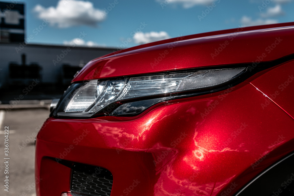 Headlight of a red car | EKATERINBURG, RUSSIA - 28 AUGUST 2018. Headlight of a red car | EKATERINBURG, RUSSIA - 28 AUGUST 2018.
