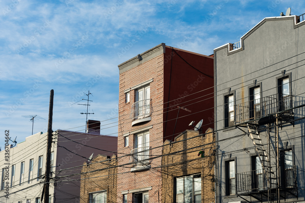 A Row of Old Residential Buildings with Fire Escapes in Astoria Queens of New York City