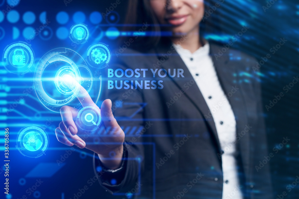 Obraz premium Business, Technology, Internet and network concept. Young businessman working on a virtual screen of the future and sees the inscription: Boost your business