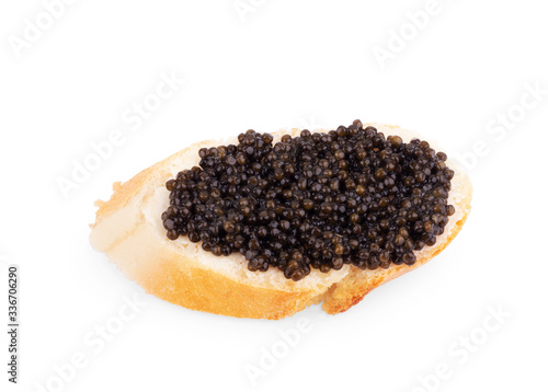 Snack with black caviar isolated on white background