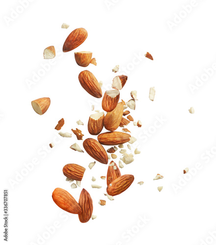 whole and crushed almonds on a white background photo