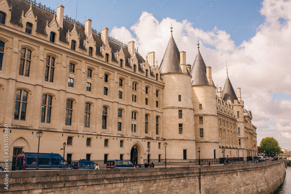 View of Conciergerie - former prison and part of old royal palace on Seine river bank in Paris, France.