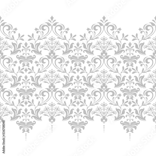 Wallpaper in the style of Baroque. Seamless vector background. White and grey floral ornament. Graphic pattern for fabric, wallpaper, packaging. Ornate Damask flower ornament.