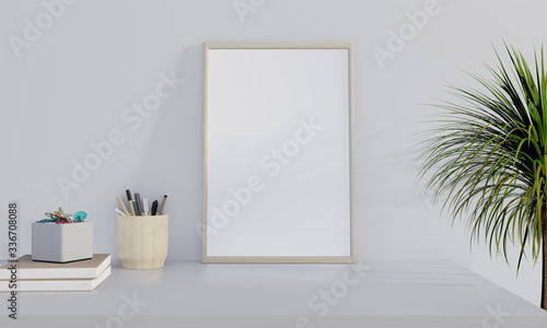 Blank photo frame on table with blue wall background. Mock up poster on table.