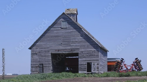 An old wooden barn on a farm in rural Iowa, USA. Tight photo