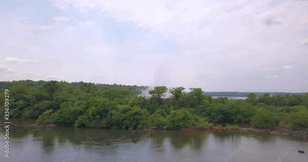 Flying Above Iguazu River and Rainforest and Approaching to Famous Waterfalls on Brazil Argentina Border, Aerial View Flying Above Iguazu River and Rainforest and Approaching to Famous Waterfalls on Brazil Argentina Border, Aerial View
