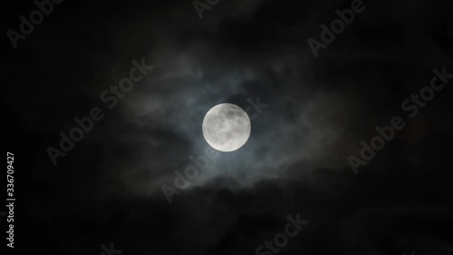 Super moon on 7th April 2020,  full moon with dark clouds moving past.