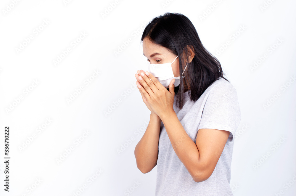 Covid-19 concept with asian woman cover mouth while sneezing on white backgrounds Covid-19 concept with asian woman cover mouth while sneezing on white backgrounds