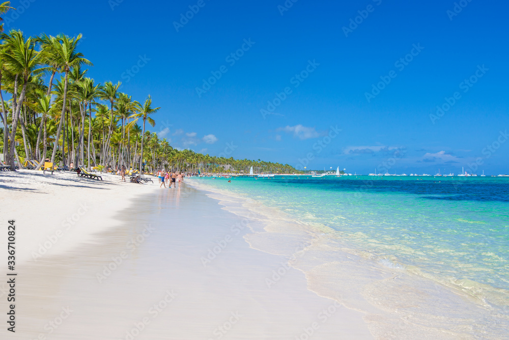 Panoramic view of Bavaro Beach on a sunny day. Tropical Bavaro Beach is a white sand and beautiful Atlantic Ocean. One of the best beaches in the Dominican Republic.